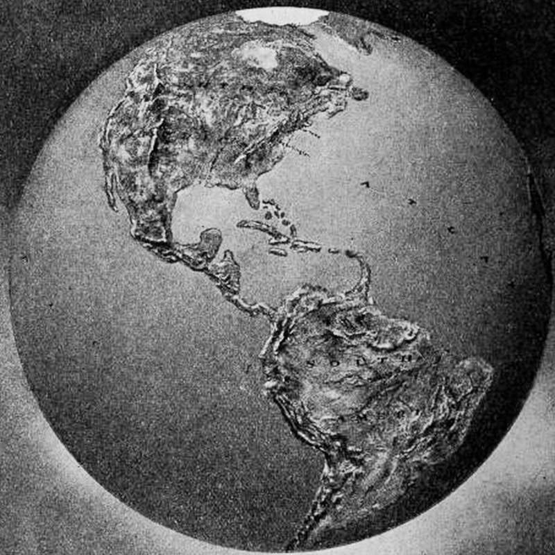 A relief globe showing the North and South American continents